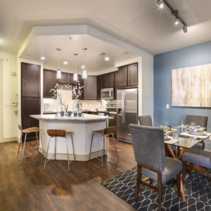 Open concept dining and kitchen area in 2 bedroom model home